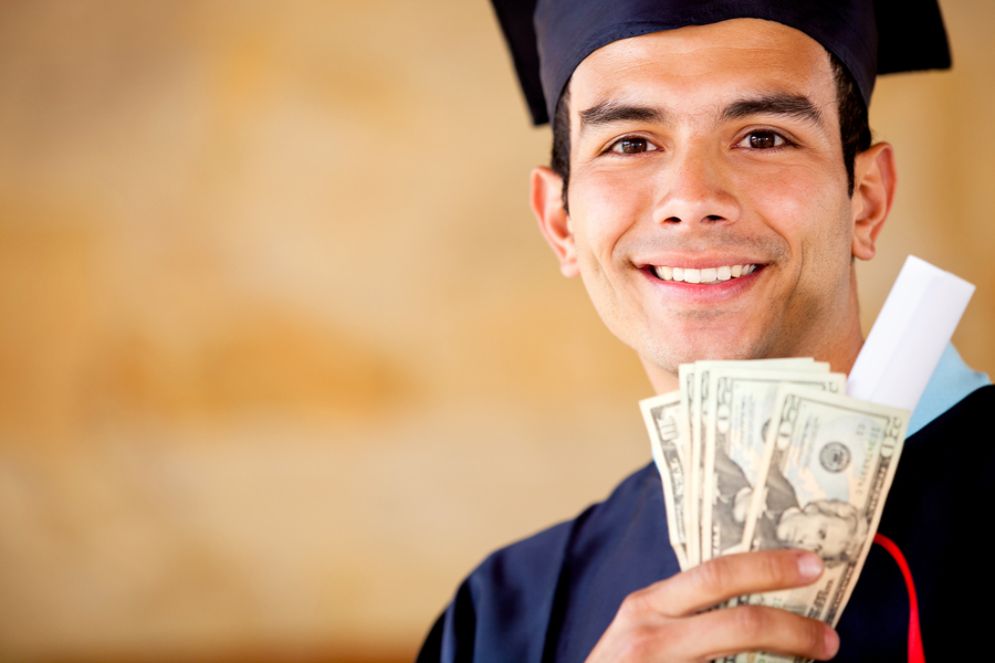 bigstock-Male-graduated-holding-money--29868566