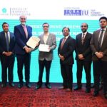 Key members of Hashoo School of Hospitality Management and Iqra University shaking hands and presenting agreement documents. Including in the picture are Mr. Haseeb Gardezi, Dr. Mirza Amin Ullah Haq, Mr. Naveed Lakhani, Dr. Zaki Rashidi, and Mr. Asad Warraich.