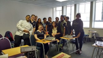 Carlo Lopes posing with some International Hotel School (Cape Town) students 