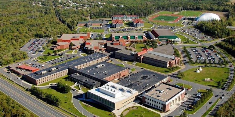 An overhead scenic view of the Cape Breton University campus, facilities and surrounding woodland.